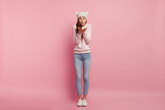 Young brunette woman wearing funny hat