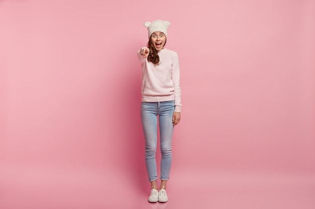 Young brunette woman wearing funny hat