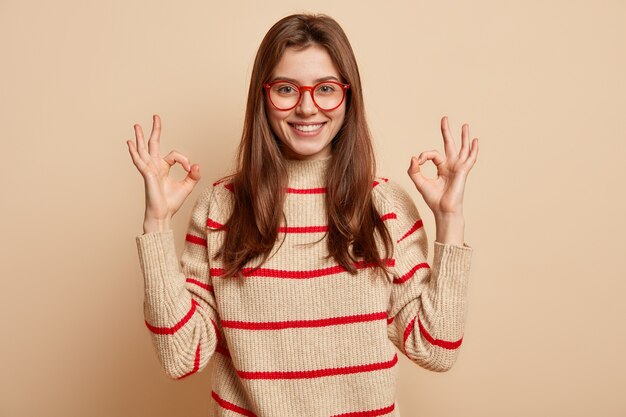 Young brunette woman wearing red eyeglasses