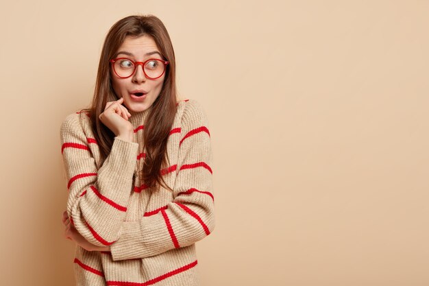 Young brunette woman wearing red glasses