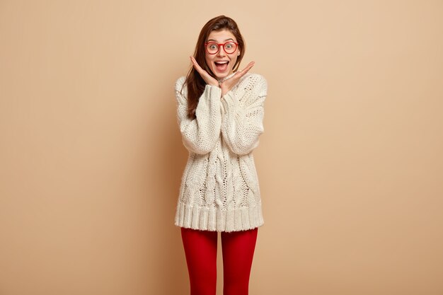 Young brunette woman wearing red glasses