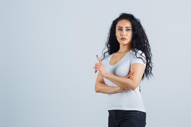 Young brunette woman in a white t-shirt