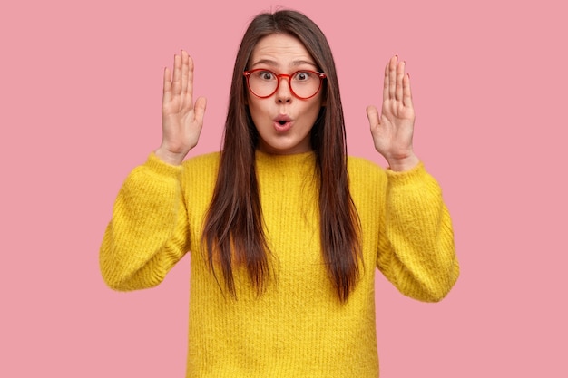 Young brunette woman in yellow sweater