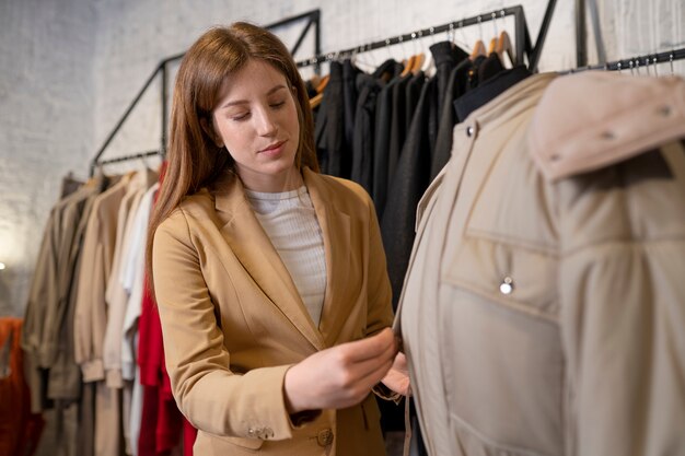 Young business owner preparing her store