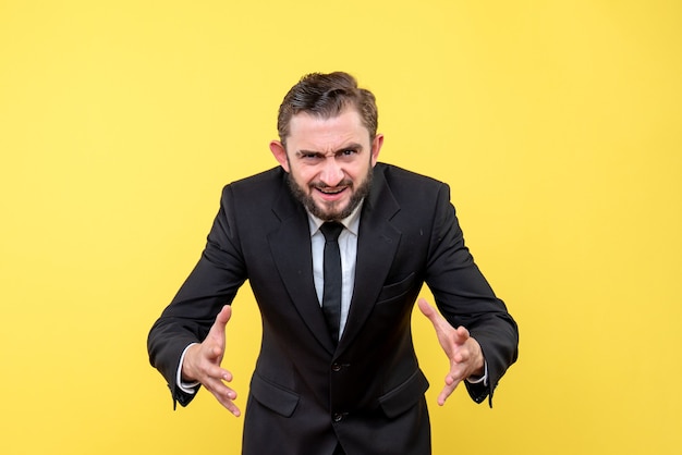 Free photo young business person explaining something on yellow