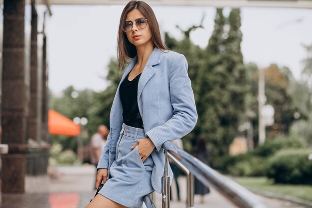 Young business woman dressed in blue suit