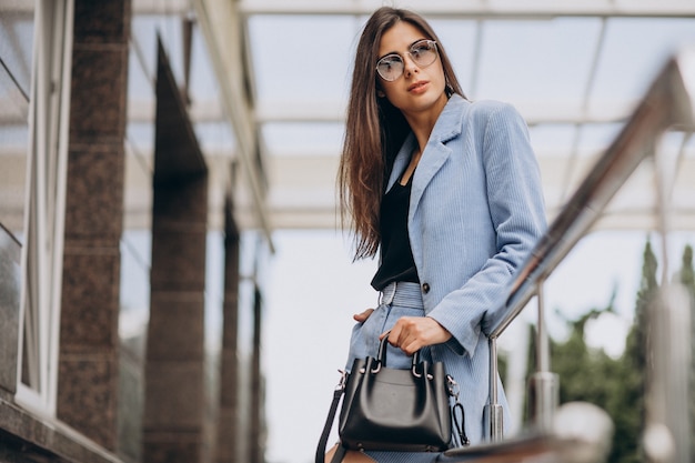 Young business woman dressed in blue suit