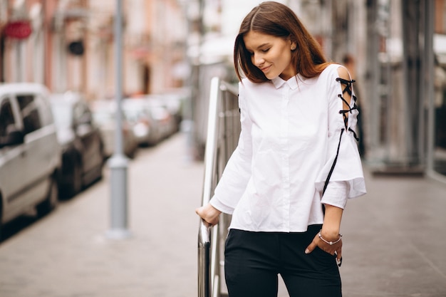 Free Photo young business woman standing outside office center