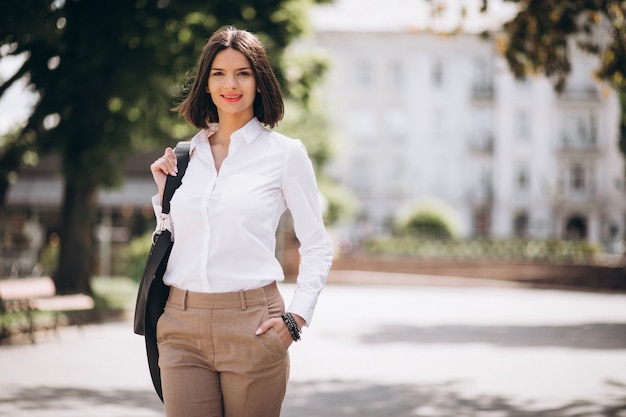 Free Photo young business woman walking in park