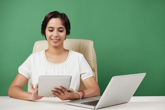 Young business woman with tablet in hands