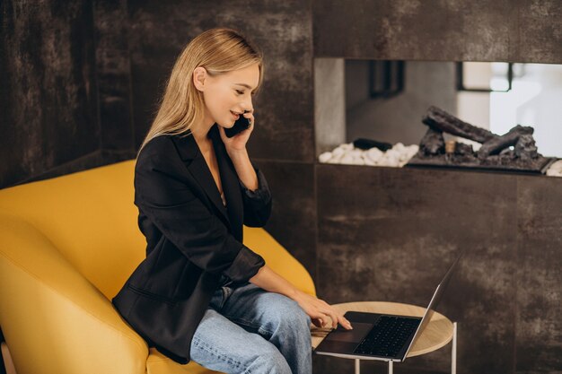 Young business woman working on laptop