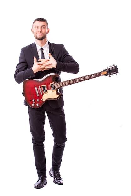 Young businessman playing guitar isolated on white wall