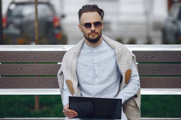 Free Photo young businessman walking on the street