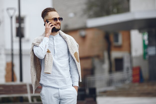 Young businessman walking on the street