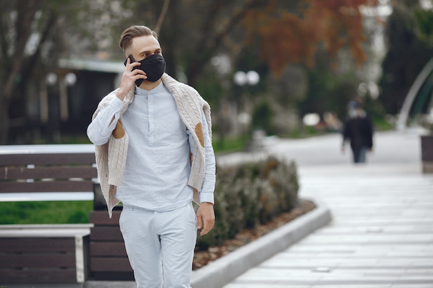 Free Photo young businessman walking on the street