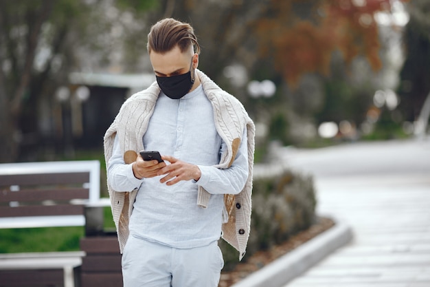 Young businessman walking on the street