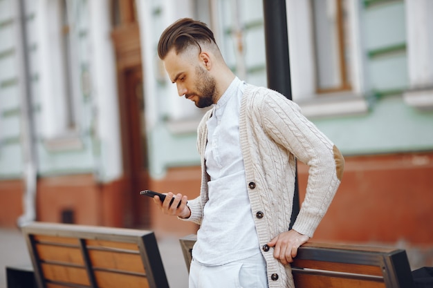 Free Photo young businessman walking on the street