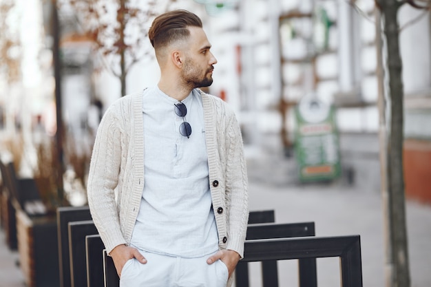 Free Photo young businessman walking on the street