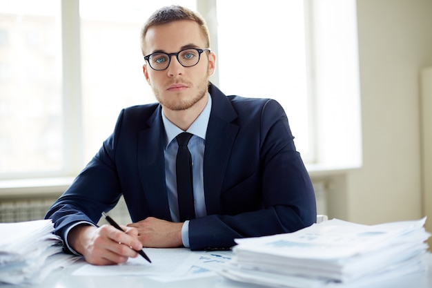 Young businessman with a lot of work