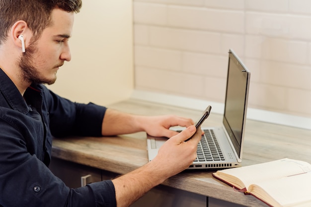 Young businessman working with computer remotely