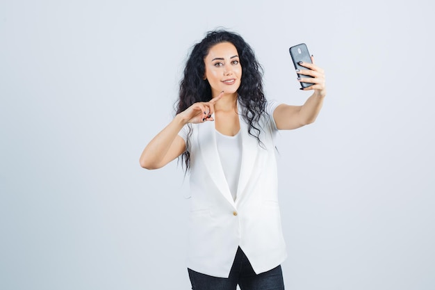 Young businesswoman taking a selfie