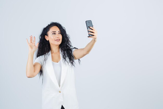 Young businesswoman taking a selfie