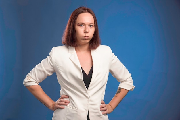 Free Photo young businesswoman in white blazer looks depressed. 