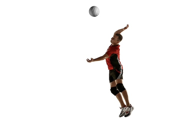 Free Photo young caucasian volleyball player placticing isolated on white background