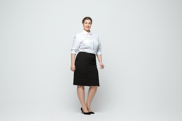 Young caucasian woman in casual wear. Body positive female character, plus size businesswoman