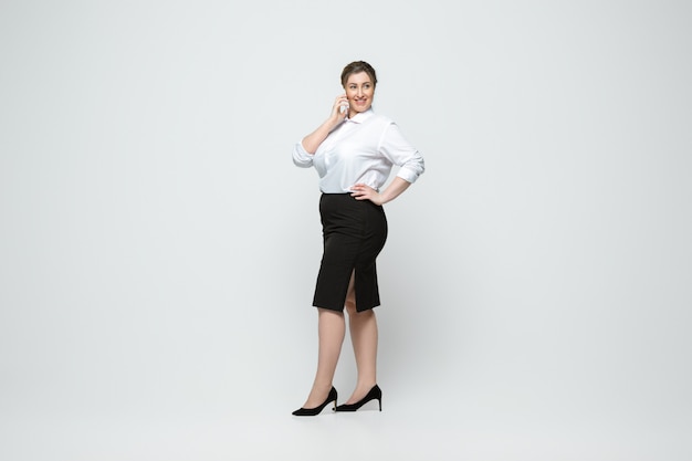 Young caucasian woman in casual wear. Body positive female character, plus size businesswoman