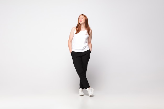 Free Photo young caucasian woman in casual wear. bodypositive female character, plus size businesswoman