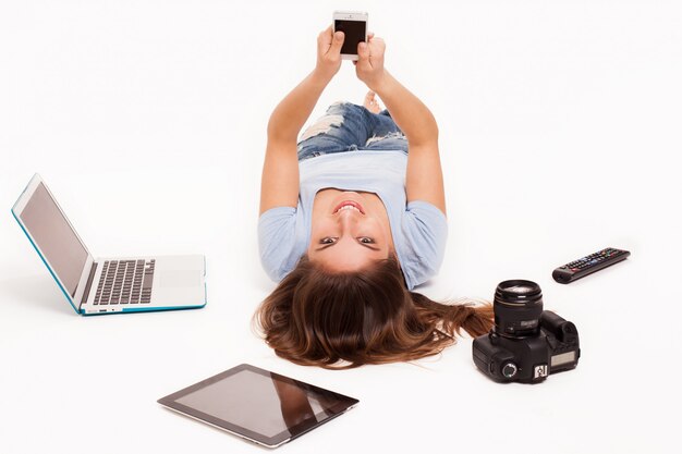 Young caucasian woman with electronic devices