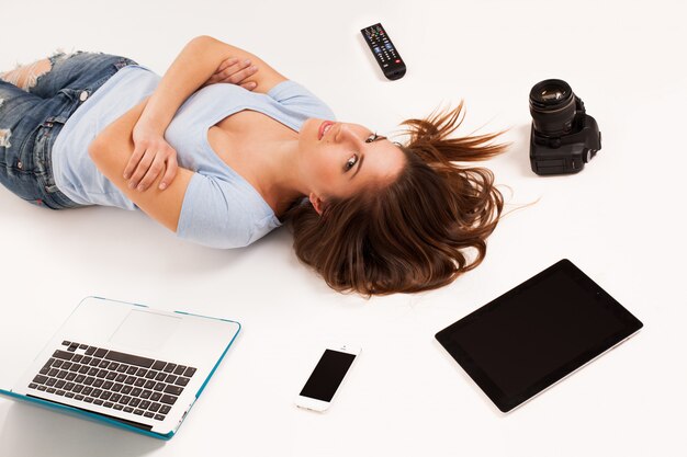 Young caucasian woman with electronic devices