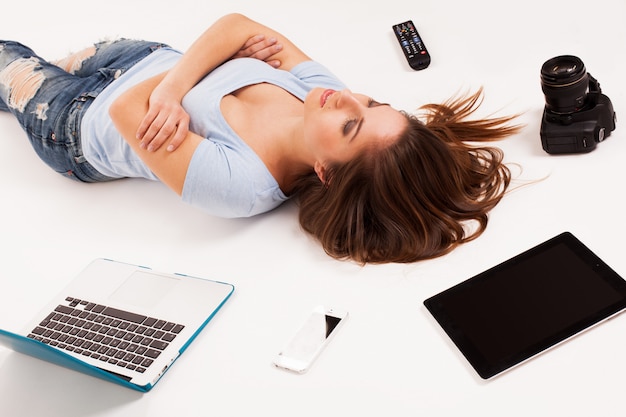 Free Photo young caucasian woman with electronic devices