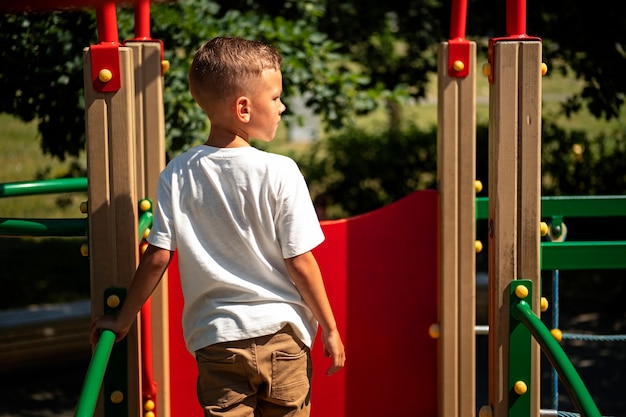 Young child having fun at the outdoors playground