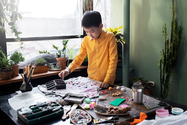 Young child making diy craft project with t-shirt