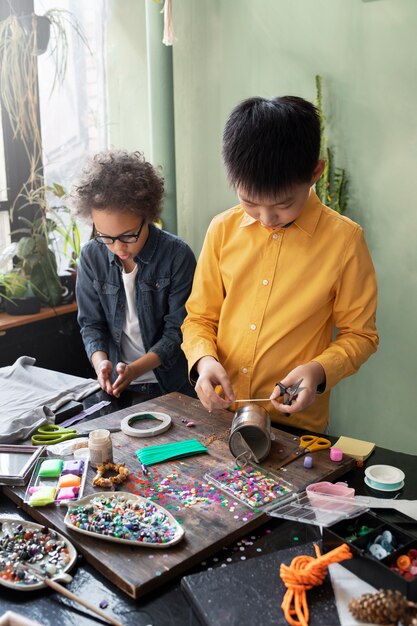 Young child making diy project from upcycled materials