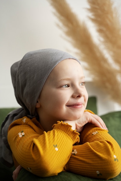 Free photo young child in therapy for battling cancer