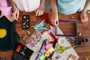 Free photo young children making diy project from upcycled materials