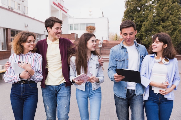 Young college students walking together