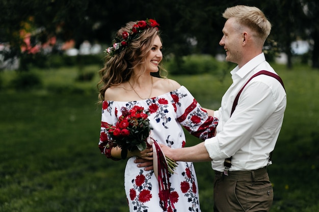 Free Photo young  couple in a blooming garden