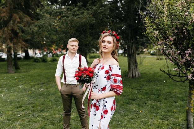 Free Photo young  couple in a blooming garden