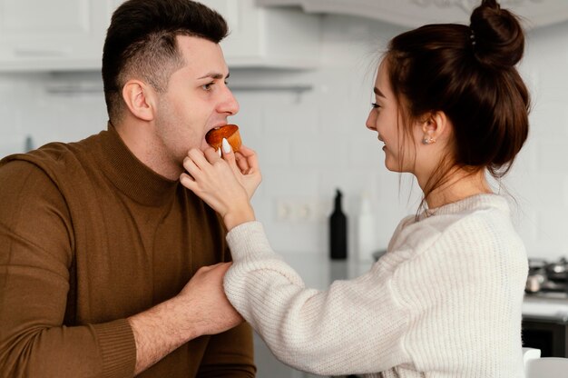 Young couple cooking at home