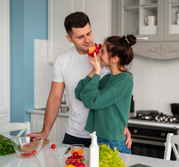 Young couple cooking at home