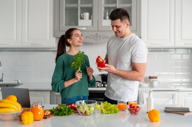 Young couple cooking at home