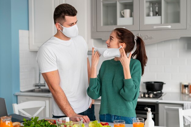 Young couple cooking at home