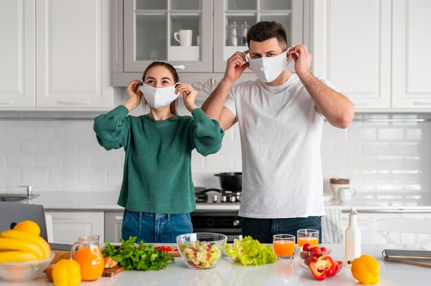 Free Photo young couple cooking at home