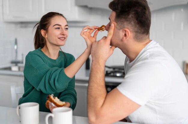 Young couple cooking at home