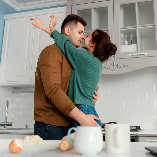 Young couple cooking at home