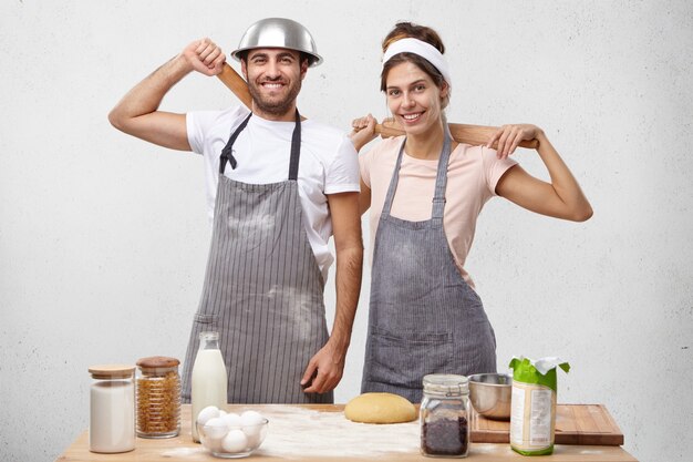 Young couple cooking together